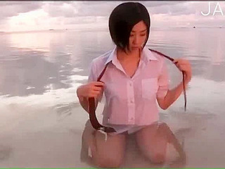 Japanese teen's horny solo session in the water gets you wet and moist!